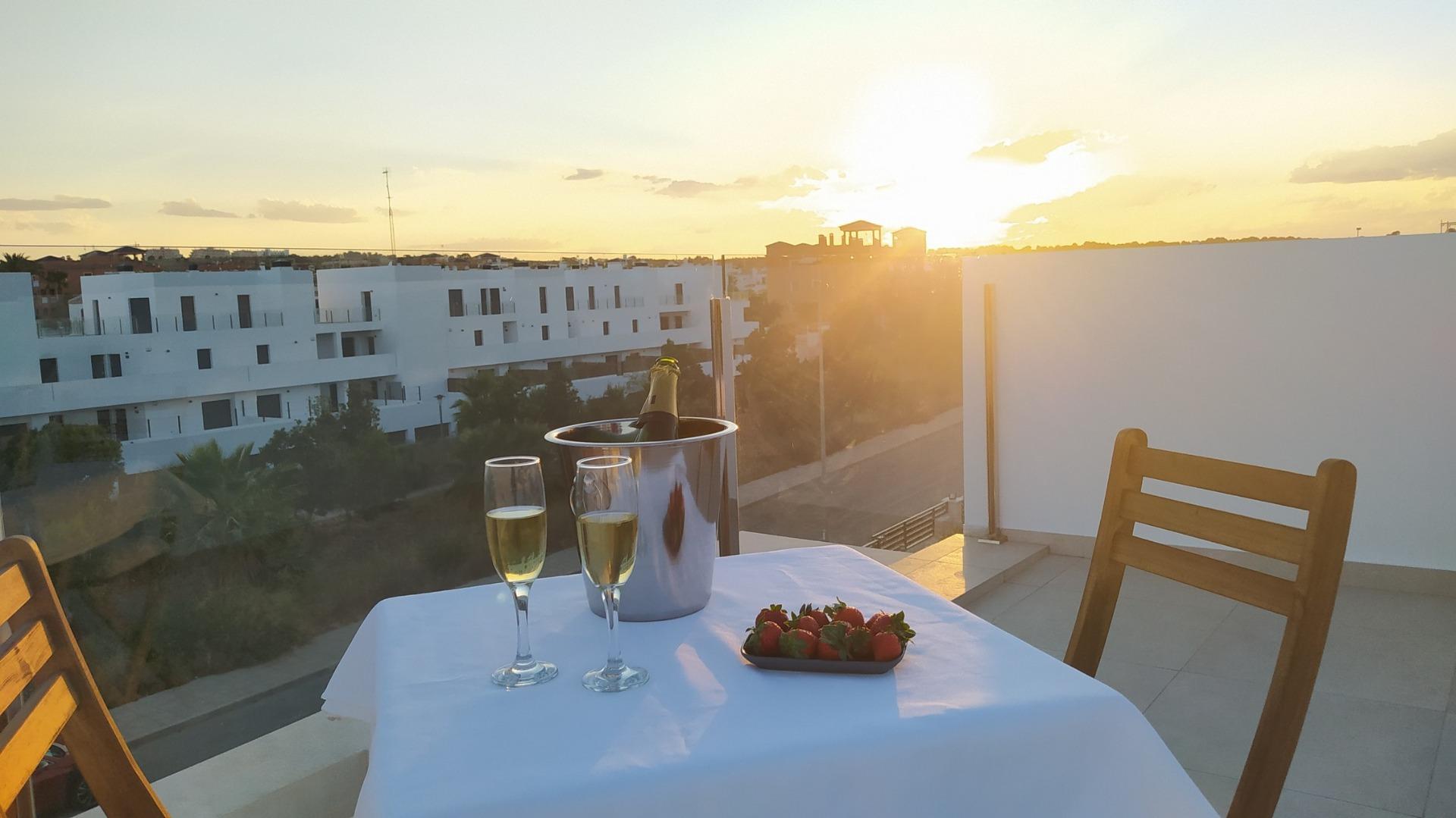Rooftop solarium at sunset overlooking a Costa Blanca urbanisation